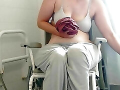 Paraplegic brunette Purplewheelz British milf peeing in the bathroom
