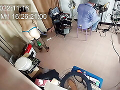 A bare maid is cleaning up in an silly IT engineer's office. Real camera in office. 