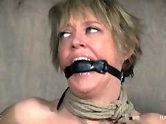 Sex sub with short hair hogtied during a BDSM session