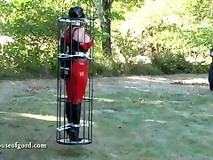 latex bondage doll jewell caged and stored in silo