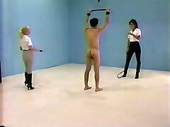Erotic whipping with two naked mistress