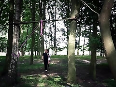 Fascinating brunette bdsm used in the woods