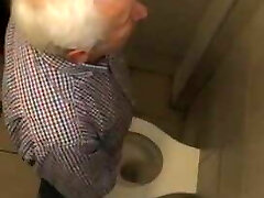 Older Greek man piss station 