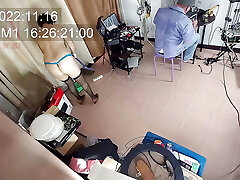 A naked maid is cleaning up in an doofy IT engineer's office. Real camera in office.