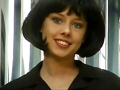 Brunette hottie with short hair opens up her pussy and fingers it for the camera