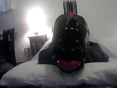 Laura is hogtied in latex catsuite and high heels, throated with a lip open mouth gag POV