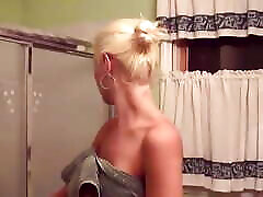 Blonde whore in heat shows her pussy while having a shower