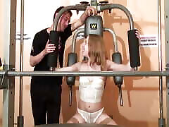Beautiful kinky tv babe gets fucked by two dudes at the gym