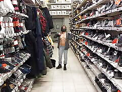 Topless woman trying clothes in out of contaeol store!