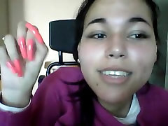 girl showing her polished long nail