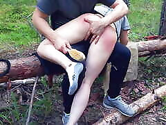 Wife spanking in the forest