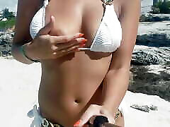Topless on public beach white bikini