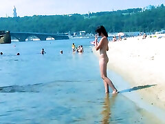 Hot nudist teen filmed by voyeur as she sits naked outside