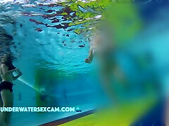 He Puts His Hands Under Her Swimming Trunks And Massages Her Ass