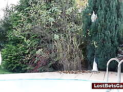 Three girls are playing trip wrestling outdoors