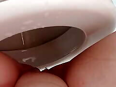 After a golden shower, her legs are dripping wet and she masturbates in the shower