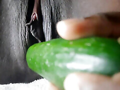 Petty girl playing with Gherkin