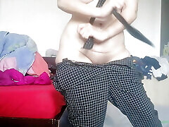 An amateur has fun trying on clothes she has cut. Amateur dances naked in the house