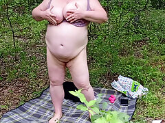 neighbor undressed in a public park and masturbates her pussy