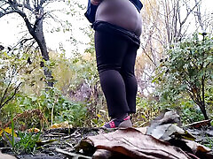 Mature curvy milf pees while squatting