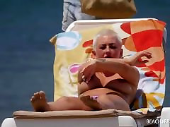 Bust pierced blonde filmed on beach
