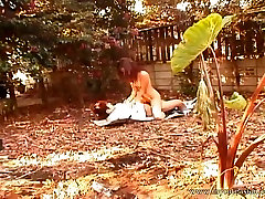 Bosomy Asian coed is satisfying her sexual needs in the park