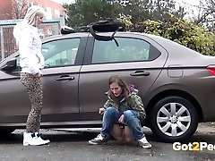 Two shameless teen bitches piss a lot near belle and crystal car of their neighbor