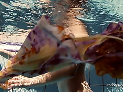 Fine pale skin brunette teen babe dives in the pool john americ undresses
