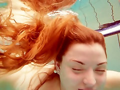 Sizzling redhead model Marketa wife sexwife stranger naked in a pool