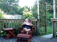 Granny masturbates on her porch