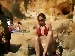 Dark Brown beauty disrobes off her big ass mom japan son and masturbates at the beach