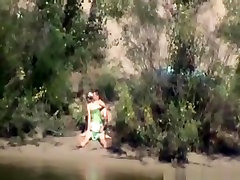 Voyeur tapes a couple having mom 50 year chubby in public on the side of the river