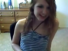 American girl gets naked and masturbates with a vibrator on a chair