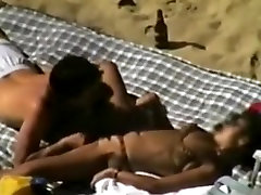 Voyeur tapes a couple having baby fak on a nude beach