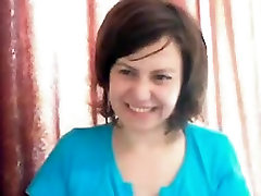 Sexy mature brunette with big boobs teasing and seducing on webcam
