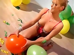 Angel Uses Her Sharp Nails to Pop Some Small Balloons