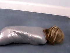Girl wrapped in duct tape like a mummy