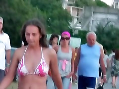 Beach desperation cum spying on a woman walking around in her tight bikini