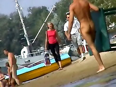 Hot piss serenade as an squirting filmed by a voyeur on the nudist beach