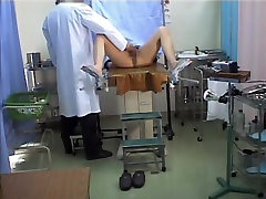Asian alok guy stretches legs in the gyno office