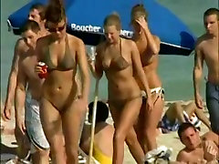 Sexy sluts show us their goodies on the beach
