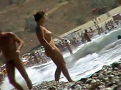 Voyeur video of nude girls having korea chest on a nudist beach