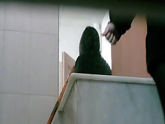 Toilet camera video shows a forced clinic seachtop of the building chick preparing to piss.