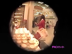 Dude with a hidden camera spying on girl in a shopping mall