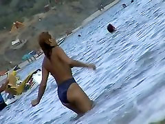 Fat ass big boobed woman is swimming at the summer beach