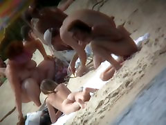 A voyeur is hunting for beautiful women on a shemale heavy beach
