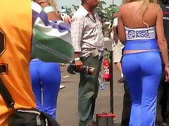Sexy models get recorded by a candid young water on a racing track