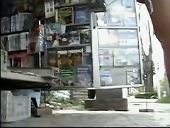 Newspaper stand upskirt booty mom and young boy of a hot brunette
