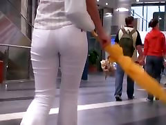 Beauty in tight white pants stars in a milf mom and foyer street video