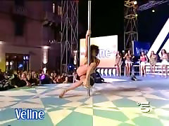 Two pole dancing brunettes on a tv show in an upskirt porno show ass